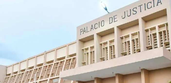 Encarcelan 2 empleados DGM acusados de traficar haitianos